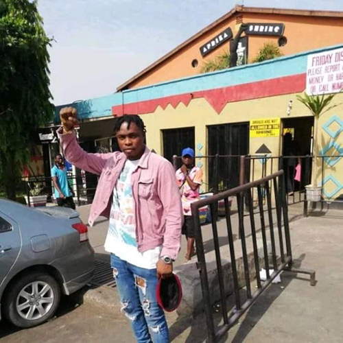 Cumber in front of The New African Shrine